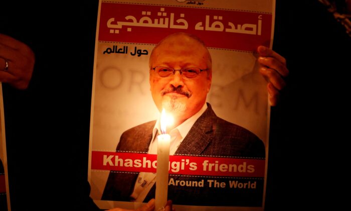 A demonstrator holds a poster with a picture of Saudi journalist Jamal Khashoggi outside the Saudi Arabia consulate in Istanbul, Turkey, on Oct. 25, 2018. (Osman Orsal/Reuters)
