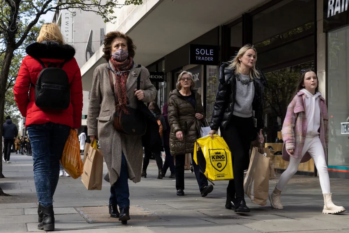 Members of the public walk along Oxford Street in London, England, on April 1, 2022. (Dan Kitwood/Getty Images)