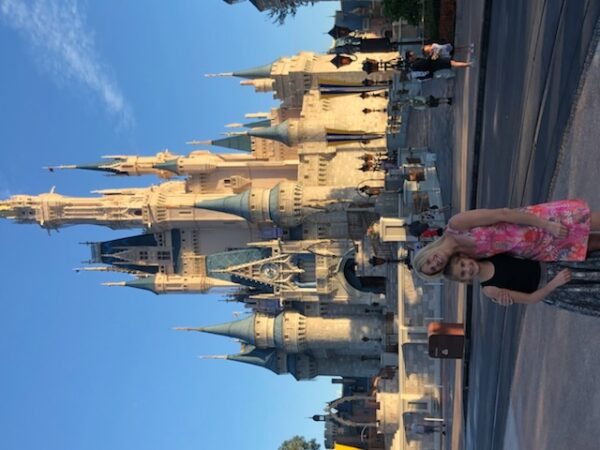 Michelle Depa and daughter Lila Stromske pose in front of Cinderella's Castle at Disney's Magic Kingdom. 