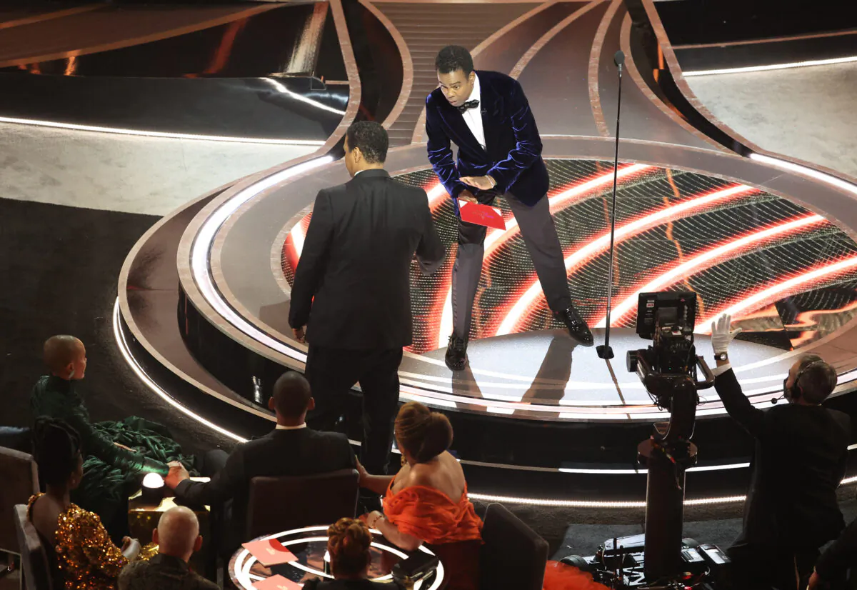 Denzel Washington, left, talks to Chris Rock onstage during the 94th Academy Awards at the Dolby Theatre, in Hollywood, on March 27, 2022. (Myung Chun/Los Angeles Times via TCA)