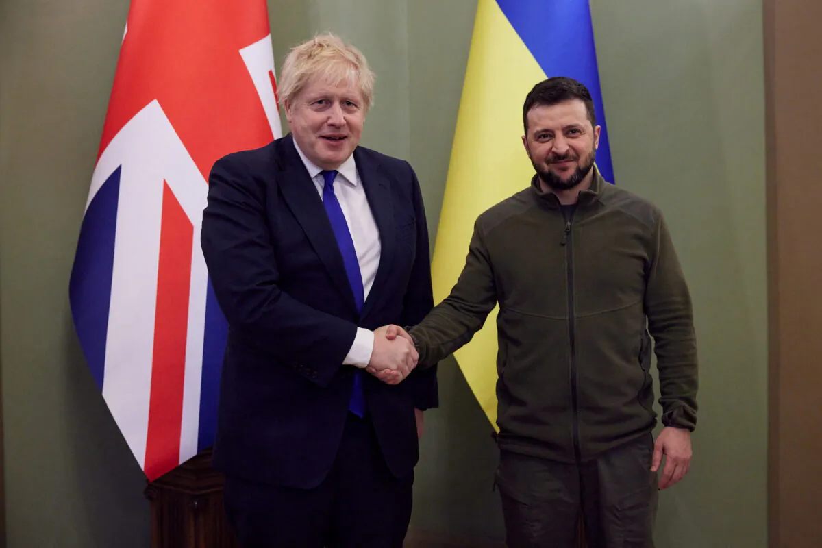 Ukraine's President Volodymyr Zelenskyy (R) and British Prime Minister Boris Johnson shake hands before a meeting, as Russia's attack on Ukraine continues, in Kyiv, Ukraine, on April 9, 2022. (Ukrainian Presidential Press Service/Handout via Reuters)