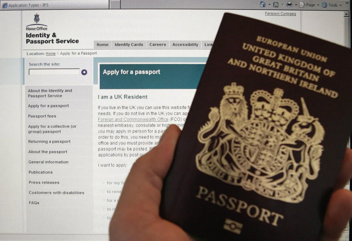 A British passport in front of a screen displaying the UK Home Office's website, in an undated file photo. (PA)