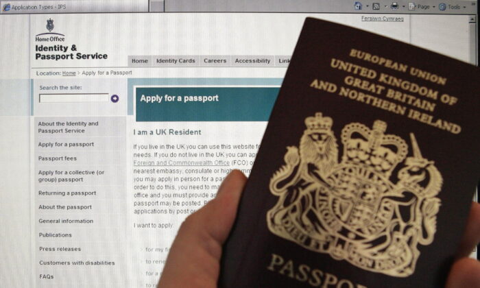 A British passport in front of a screen displaying the UK Home Office's website, in an undated file photo. (PA)