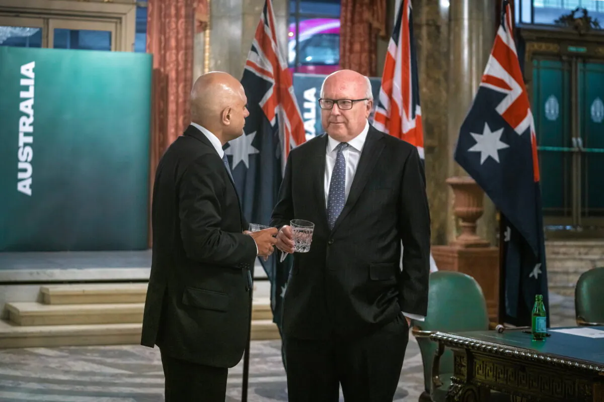 Australian High Commissioner George Brandis (right), speaking to Health Secretary Sajid Javid on Sept. 3, 2021. (Department of Health and Social Care via PA)
