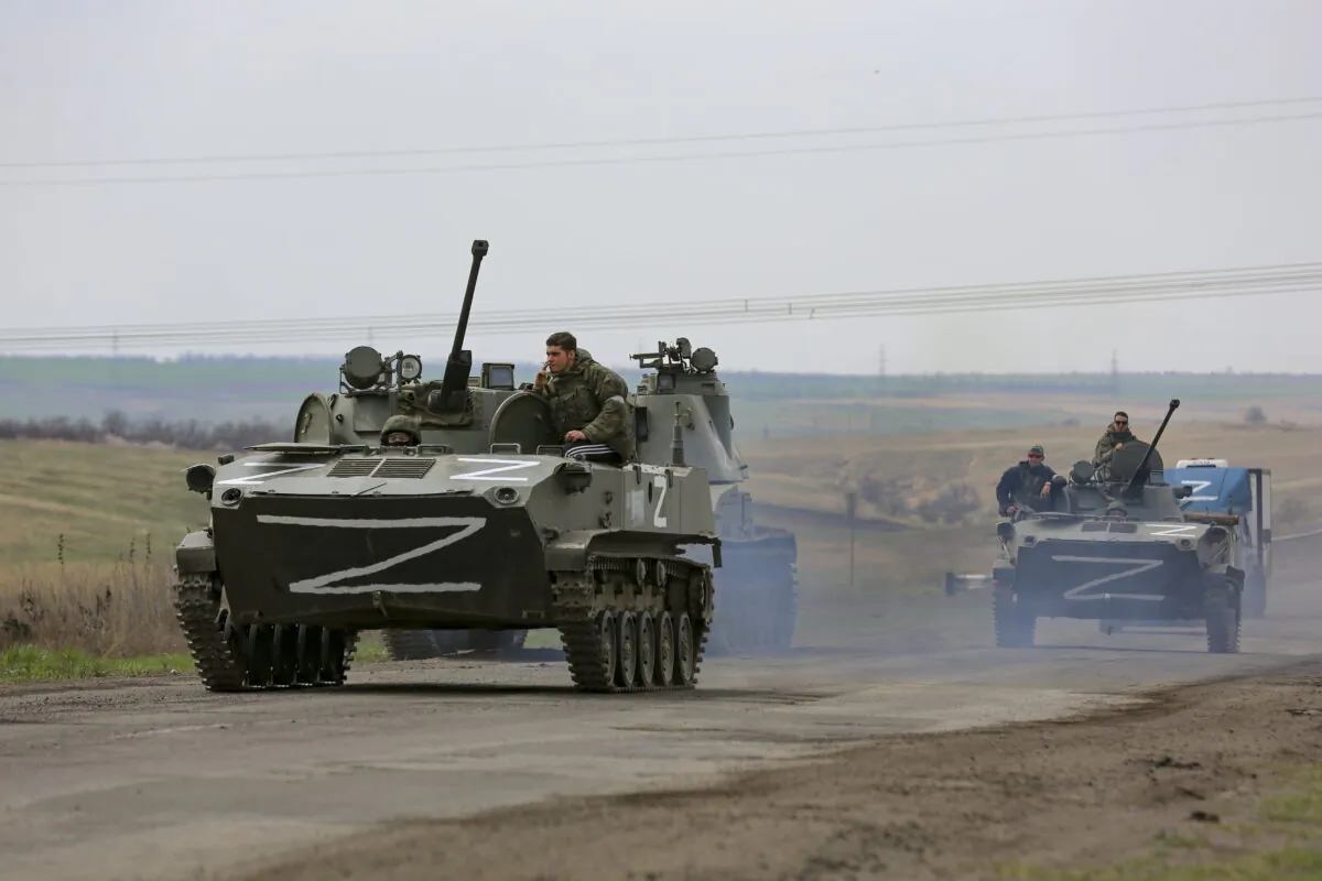 Undated photo showing Russian military vehicles move on a highway in an area controlled by Russian-backed separatist forces near Mariupol, Ukraine. (Alexei Alexandrov/AP/PA)
