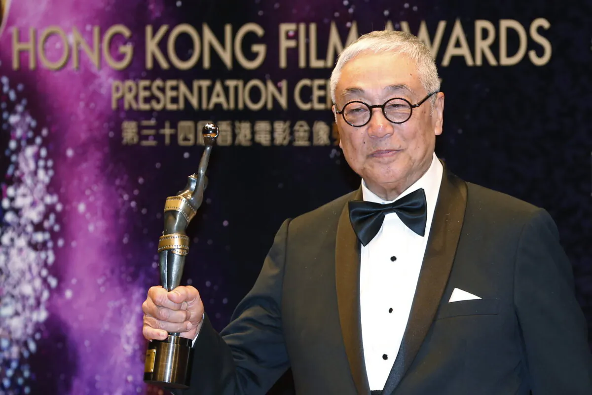 Hong Kong actor Kenneth Tsang poses after winning the Best Supporting Actor award for his movie "Overhead 3" during the Hong Kong Film Awards in Hong Kong on April 19, 2015. (Kin Cheung/AP Photo)
