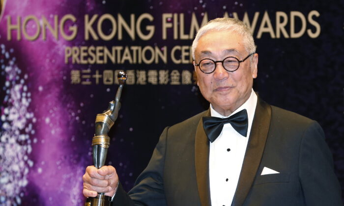 Hong Kong actor Kenneth Tsang poses after winning the Best Supporting Actor award for his movie "Overhead 3" during the Hong Kong Film Awards in Hong Kong on April 19, 2015. (Kin Cheung/AP Photo)