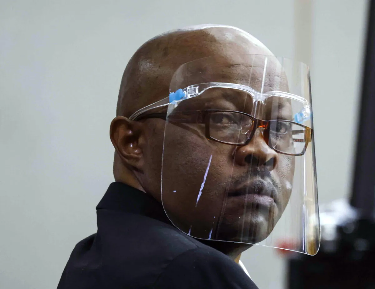 Accused serial killer Billy Chemirmir looks back ahead of his retrial on Monday, April 25, 2022, at Frank Crowley Courts (Shafkat Anowar/The Dallas Morning News via AP, Pool)