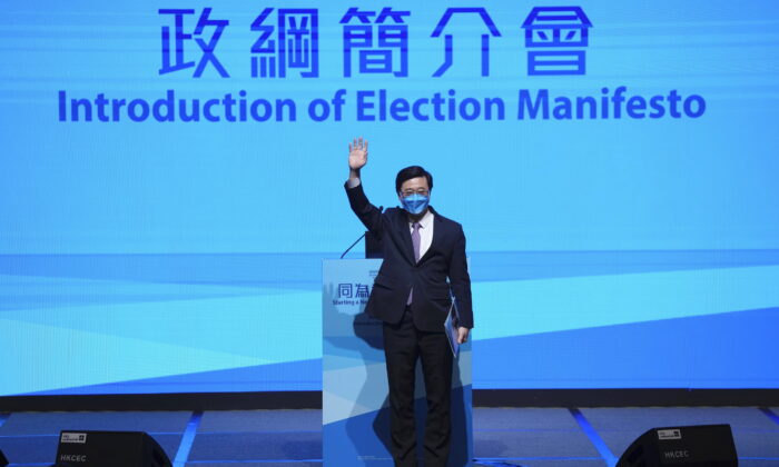 John Lee, former No. 2 official in Hong Kong, and the only candidate for the city's top job, announces his manifesto during the 2022 chief executive electoral campaign in Hong Kong, Friday, April 29, 2022.  (Kin Cheung/AP Photo)
