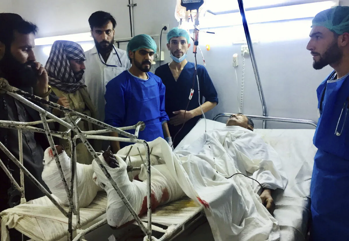 A wounded man receives treatment in a hospital, after a bombing in Mazar-e-Sharif, northern Afghanistan, on April 28, 2022. (AP Photo)