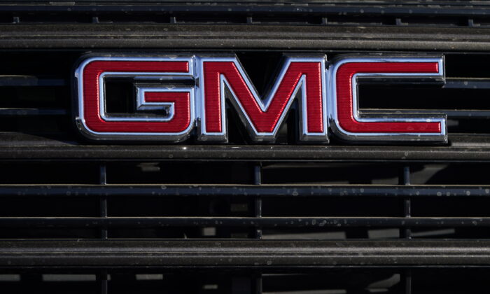 A GMC company logo is displayed at a GMC Truck dealership in Castle Rock, Colo., on Feb. 7, 2021. (David Zalubowski/AP Photo)