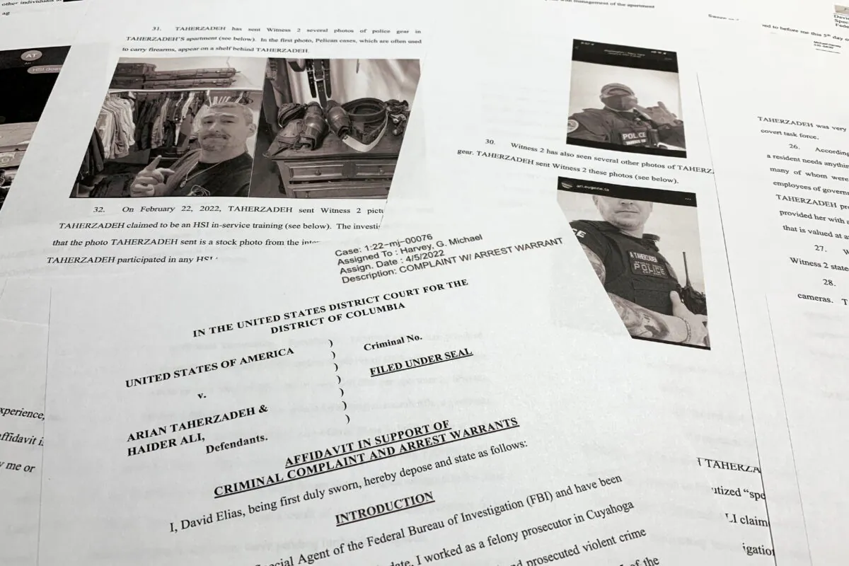 The affidavit to support the arrest of Arian Taherzadeh and Haider Ali is photographed on April 6, 2022. (Jon Elswick/AP Photo)