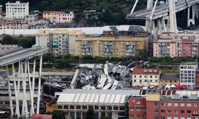 Cars are blocked on the Morandi highway bridge after a large section of it collapsed in Genoa, Italy, on Aug. 14, 2018. (Antonio Calanni/AP Photo)