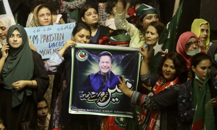 Supporters of deposed Prime Minister Imran Khan's party participate in a rally to condemn the ouster of their leader's government, in Karachi, Pakistan, on April 10, 2022. (Fareed Khan/AP Photo)