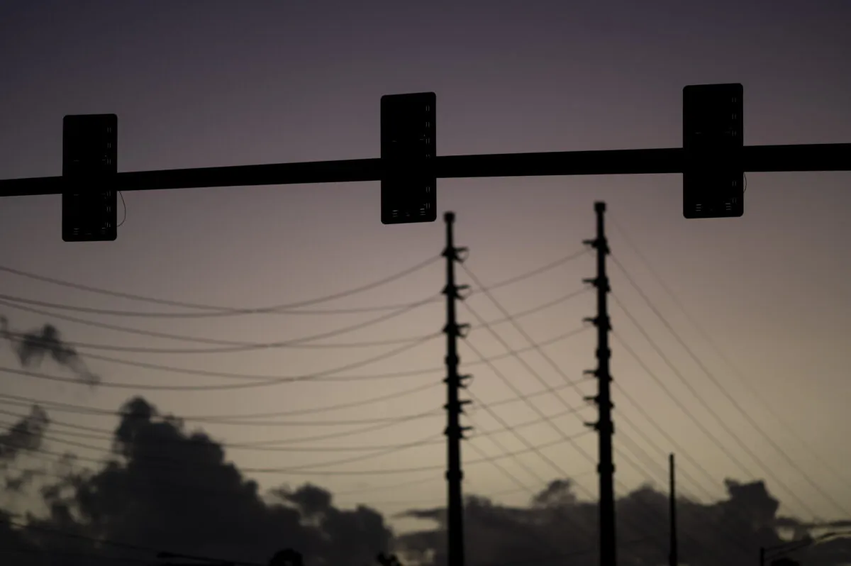 With a hotter than usual summer projected, federal agencies are warning utilities of an "elevated risk" of power outages across two-thirds of North America between June and September. (Carlos Giusti/AP Photo)