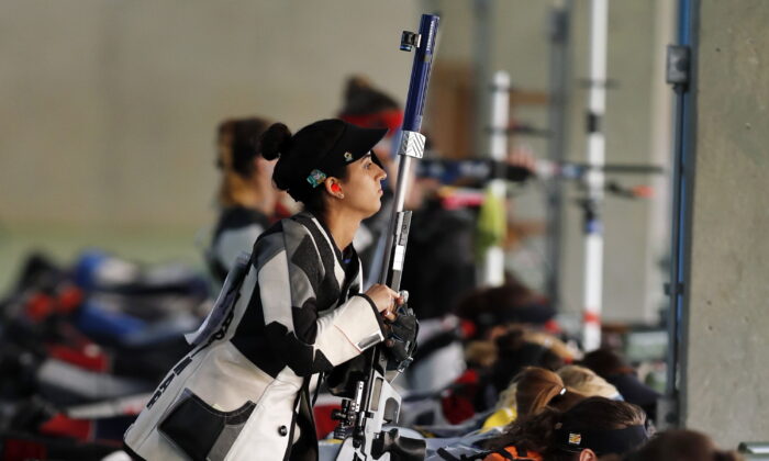 Yarimar Mercado Martinez, of Puerto Rico, competes during the women's 50-meter Rifle 3 Positions qualification, at the Olympic Shooting Center in Rio de Janeiro, on Aug. 11, 2016. (Hassan Ammar/AP Photo)