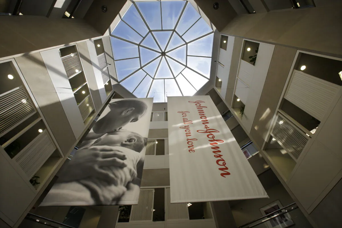 Large banners hang in an atrium at the headquarters of Johnson & Johnson in New Brunswick, N.J., on July 30, 2013. (Mel Evans/AP Photo)