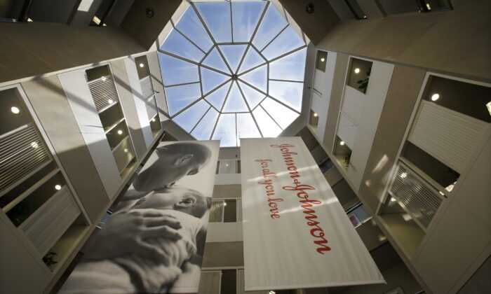 Large banners hang in an atrium at the headquarters of Johnson & Johnson in New Brunswick, N.J., on July 30, 2013. (Mel Evans/AP Photo)