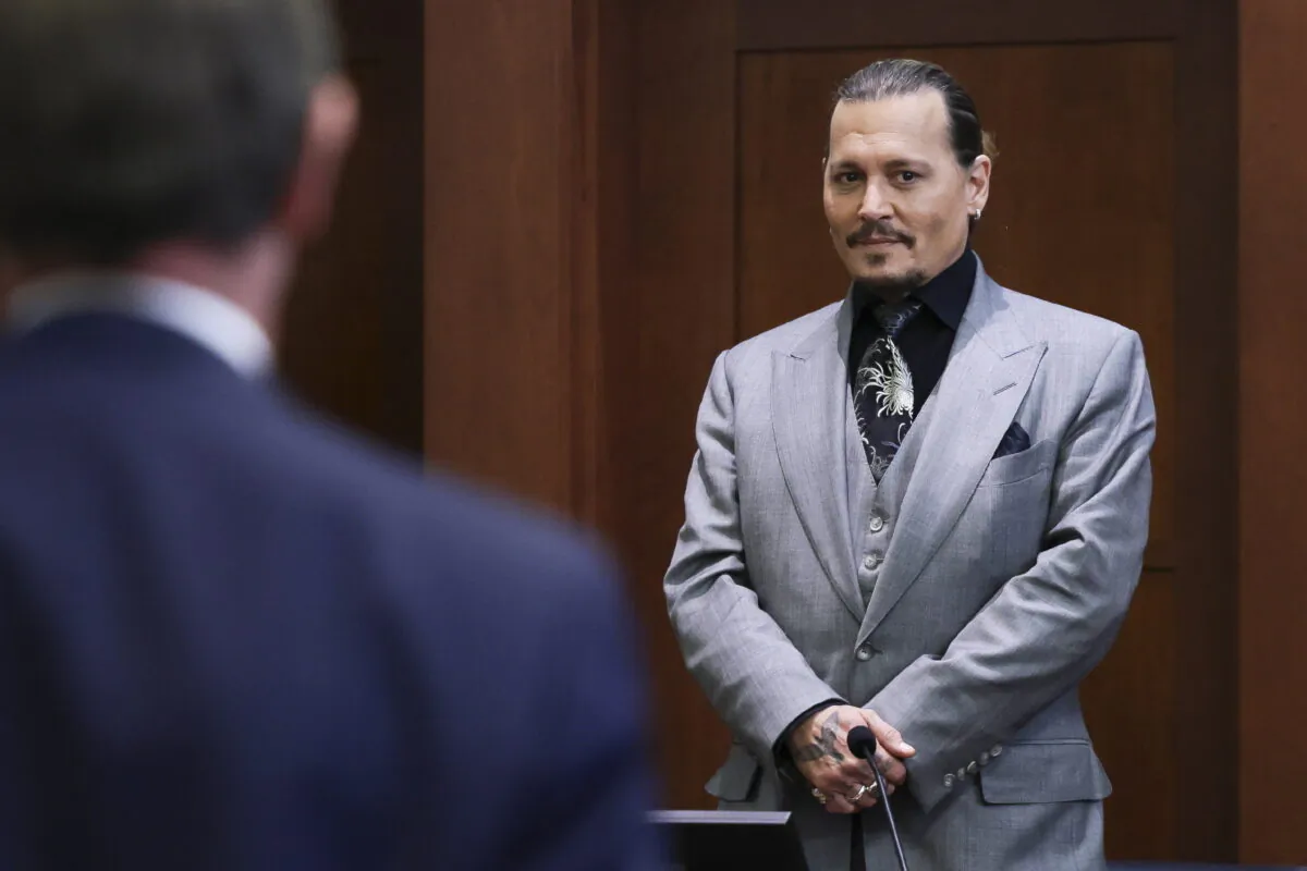 Actor Johnny Depp looks on at the end of the second day of his testimony in the courtroom at the Fairfax County Circuit Court in Fairfax, Va., on April 20, 2022. (Evelyn Hockstein/Pool via AP)