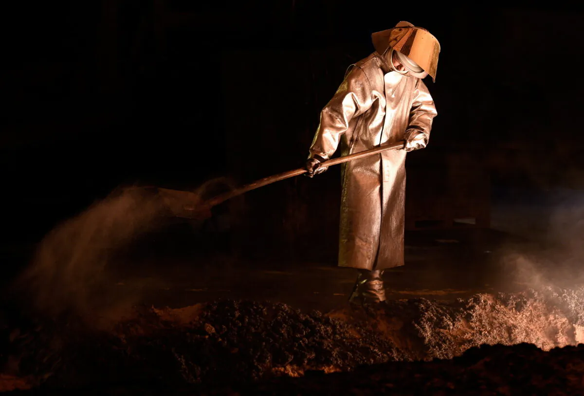 A steelworker is pictured at a furnace at the plant of German steel company Salzgitter AG in Salzgitter, Lower Saxony, on March 3, 2016. (Fabian Bimmer/Reuters)