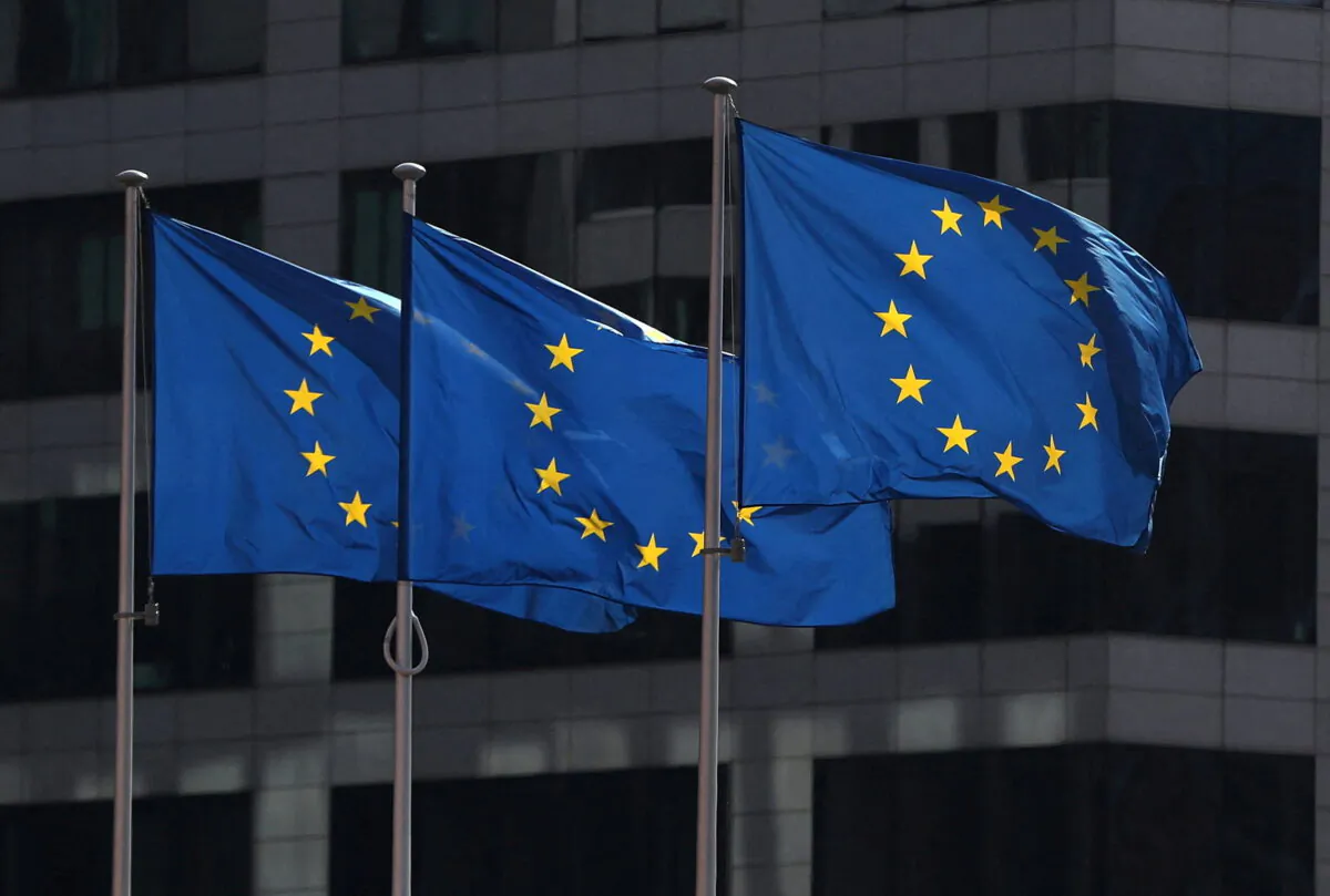 European Union flags flutter outside the EU Commission headquarters in Brussels, Belgium, on July 14, 2021. Yves Herman/Reuters