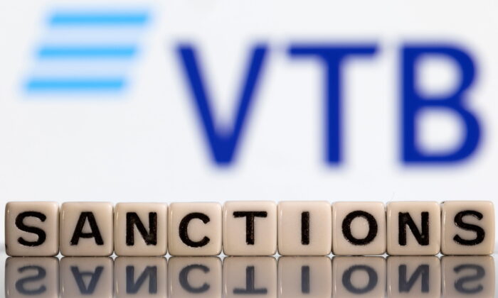 Plastic letters arranged to read "Sanctions" are placed in front of VTB bank logo in this illustration taken, Bosnia and Herzegovina, on Feb. 25, 2022. (Dado Ruvic/Illustration/Reuters)