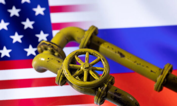 3D printed Natural Gas Pipes are placed on displayed U.S. and Russian flags in this illustration taken, on Jan. 31, 2022. (Dado Ruvic/Illustration/Reuters)