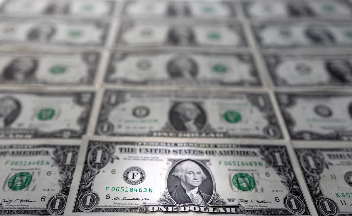 U.S. dollar banknotes are displayed in this illustration taken, on Feb. 14, 2022. (Dado Ruvic/Reuters)