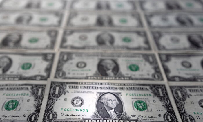 U.S. dollar banknotes are displayed in this illustration taken, on Feb. 14, 2022. (Dado Ruvic/Reuters)