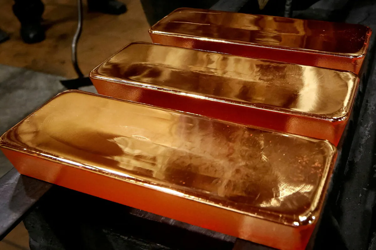 Employees process ingots of 99.99 percent pure gold at the Krastsvetmet nonferrous metals plant in the Siberian city of Krasnoyarsk, Russia, on Nov. 22, 2018. (Reuters)