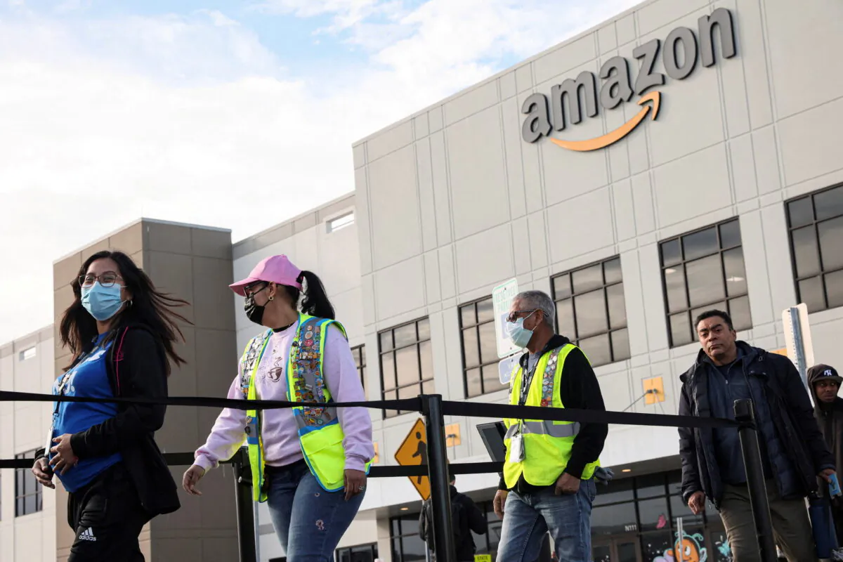 Workers stand in line to cast ballots for a union election at Amazon's JFK8 distribution center in the Staten Island borough of New York City on March 25, 2022. (Brendan McDermid/REUTERS)