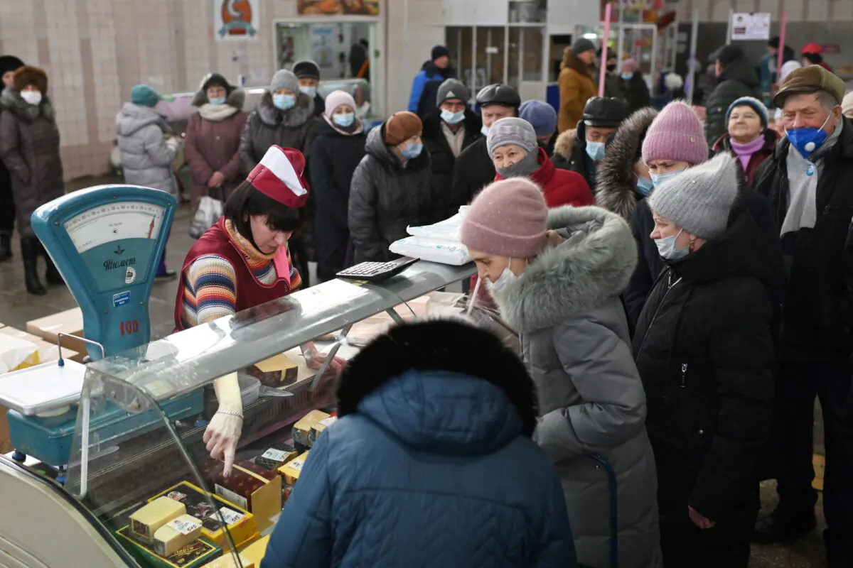 Customers line up next to a counter at a market in Omsk, Russia, on Feb. 18, 2022. (Alexey Malgavko/File Photo/Reuters)