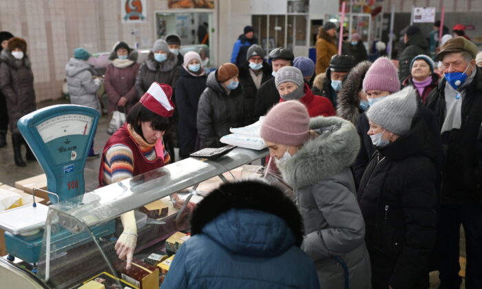 Customers line up next to a counter at a market in Omsk, Russia, on Feb. 18, 2022. (Alexey Malgavko/File Photo/Reuters)