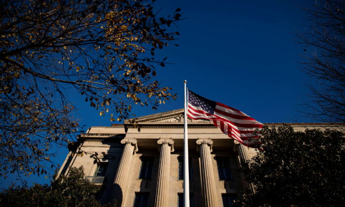 An American flag waves outside the Department of Justice Building in Washington on Dec. 15, 2020. (Al Drago/Reuters)