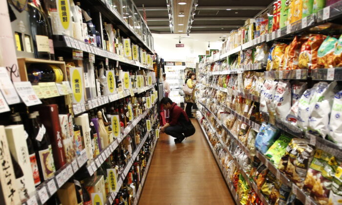 A shopper looks at alcohol products at an aisle in a luxury food store in Tokyo on Sept. 25, 2014. (Yuya Shino/Reuters)