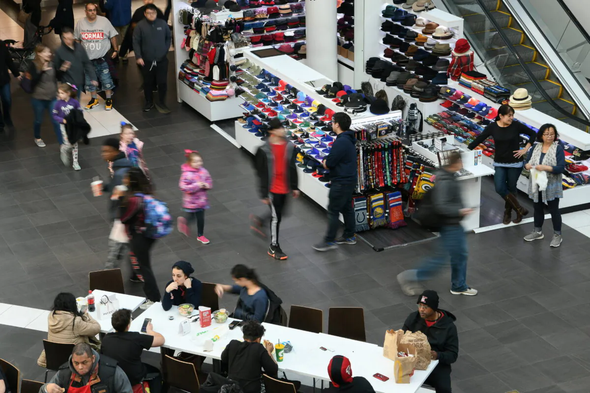 Shoppers look for deals at the Pentagon City Mall in Arlington, Va., on Nov. 29, 2019. (Loren Elliott/Reuters)
