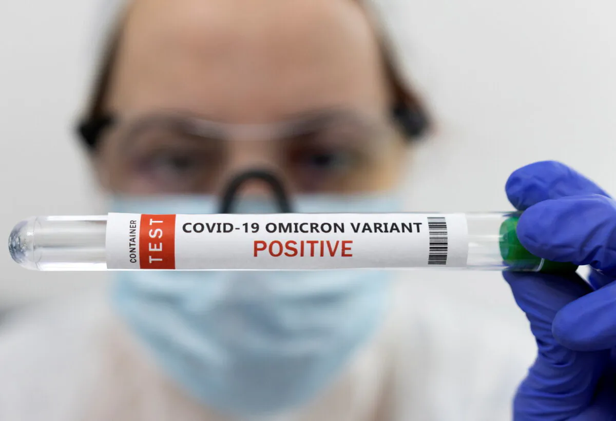 A test tube labelled "COVID-19 Omicron variant POSITIVE" is seen in this photo illustration taken Jan. 15, 2022. (Dado Ruvic/REUTERS)