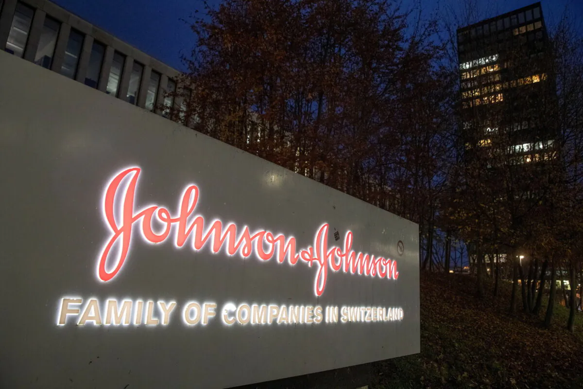 The logo of healthcare company Johnson & Johnson is seen in front of an office building in Zug, Switzerland, on Dec. 1, 2021. (Arnd Wiegmann/Reuters)