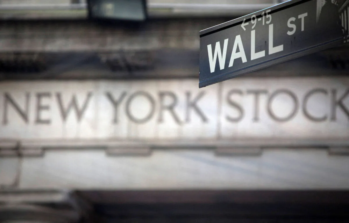 A Wall Street sign outside the New York Stock Exchange in New York, on Oct. 28, 2013. (Carlo Allegri/Reuters)