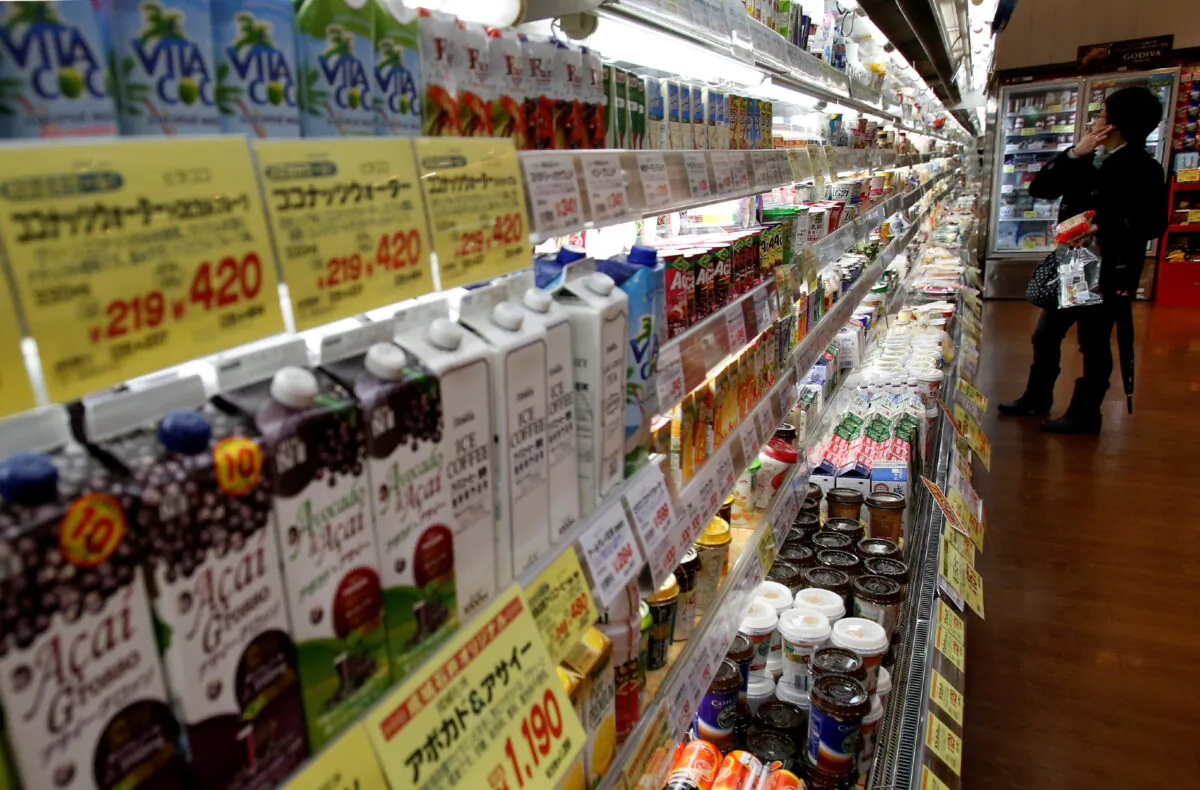 A shopper looks at items at a supermarket in Tokyo, on Feb. 26, 2015. (Yuya Shino/Reuters)