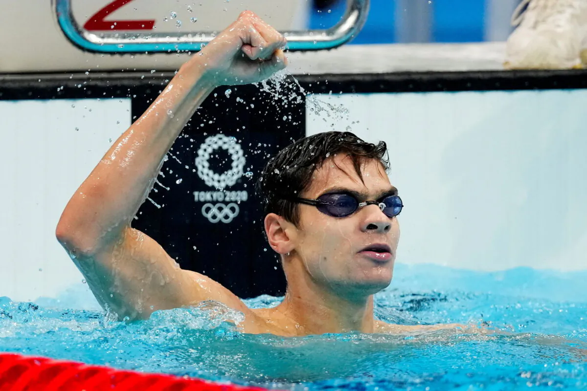 Evgeny Rylov of the Russian Olympic Committee reacts after winning the gold medal in the men's 100m Backstroke at the Tokyo Olympics on July 27, 2021. (Aleksandra Szmigiel/Reuters)