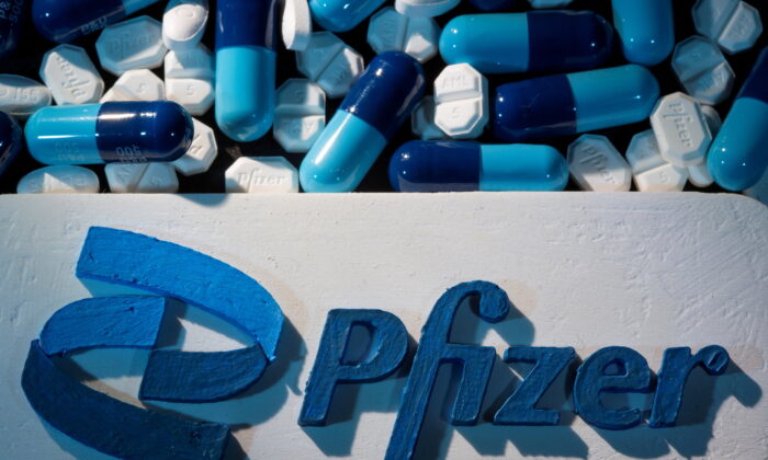 A 3D printed Pfizer logo is placed near medicines from the same manufacturer in this illustration taken on Sept. 29, 2021. (Dado Ruvic/Reuters)