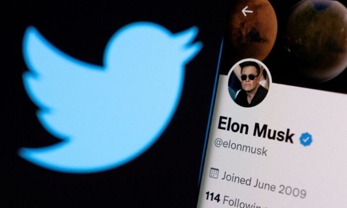 Elon Musk's twitter account is seen on a smartphone in front of the Twitter logo, on April 15, 2022. (Dado Ruvic/Illustration/Reuters)