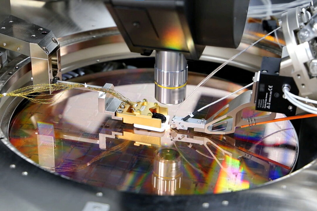 A view of a PsiQuantum Wafer, a silicon wafer containing thousands of quantum devices, including single-photon detectors, manufactured via PsiQuantum's partnership with GlobalFoundries in Palo Alto, Calif., U.S., in an undated photo taken in March 2021. (PsiQuantum/Handout via Reuters)