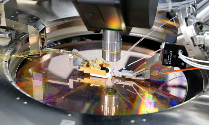 A view of a PsiQuantum Wafer, a silicon wafer containing thousands of quantum devices, including single-photon detectors, manufactured via PsiQuantum's partnership with GlobalFoundries in Palo Alto, Calif., on March 2021. (PsiQuantum/Reuters)