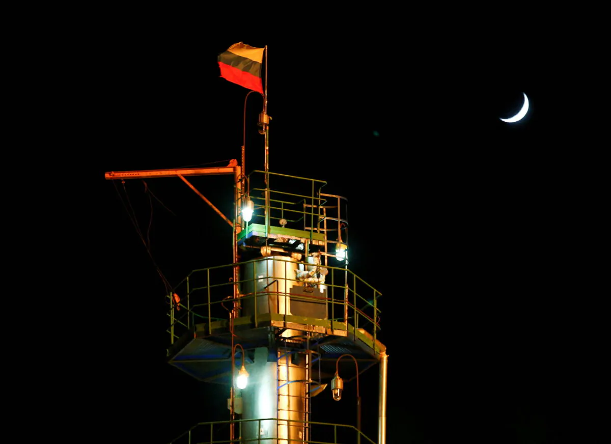 A Russian state flag flies on the top of a diesel plant in the Yarakta Oil Field, owned by Irkutsk Oil Company (INK), in Irkutsk Region, Russia, on March 10, 2019. (Vasily Fedosenko/Reuters)