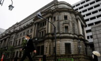BOJ Maintains Stimulus, Vows to Continue Unlimited Bond Buying