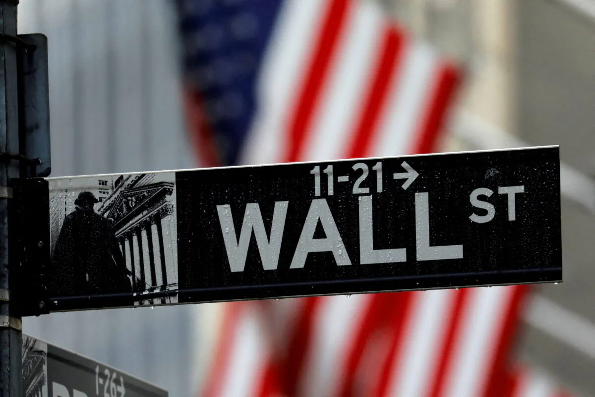 Raindrops hang on a sign for Wall Street outside the New York Stock Exchange in Manhattan in New York on Oct. 26, 2020. (Mike Segar/Reuters)