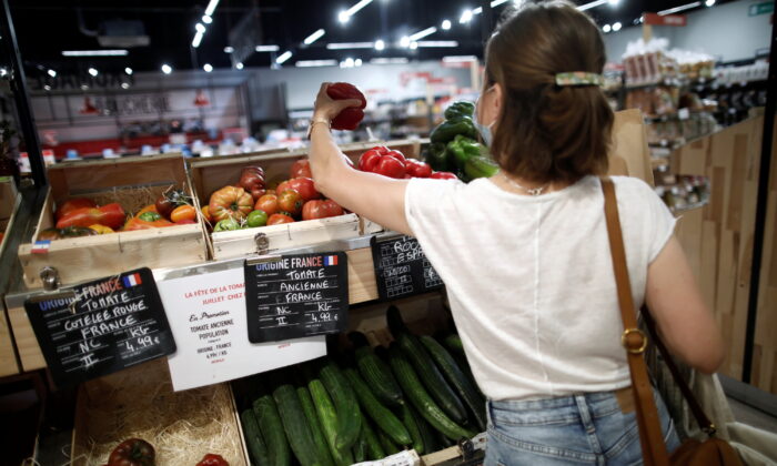A customer shops for vegetables at a Naturalia organic foods grocery store operated by Casino Group, following the outbreak of the COVID-19, in Bretigny-sur-Orge, near Paris, on July 30, 2020. (Benoit Tessier/Reuters)