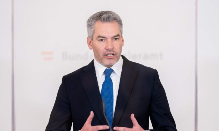 Austrian Chancellor Karl Nehammer gives a press statement on the situation in Ukraine after a meeting of the crisis cabinet in Vienna on Feb. 22, 2022. (Georg Hochmuth/APA/AFP via Getty Images)